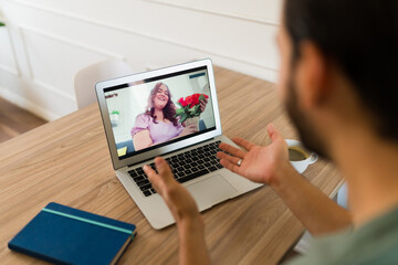 Happy couple in a long distance relationship having a virtual date