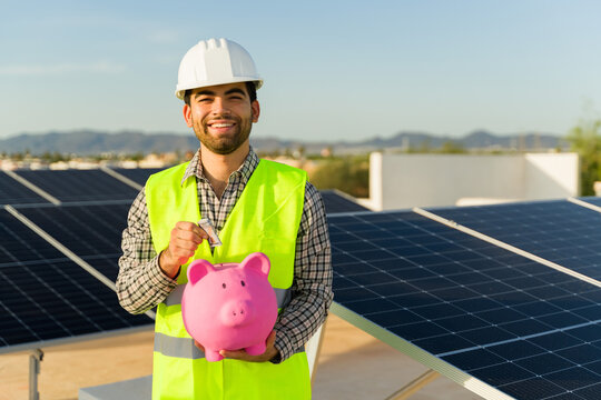 Young man engineer saving money working with solar panels
