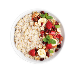 Delicious oatmeal with freeze dried berries, banana, nuts and mint on white background, top view