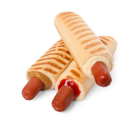 Tasty french hot dogs with different sauces on white background