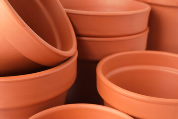 Many clay flower pots as background, closeup