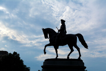 silhouette of equestrian statue of George Washington in Boston Public Garden, Massachusetts, USA