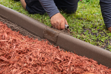 Garden worker shaping a border