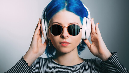 Electronic music. Digital people. Futuristic technology. Funky woman with blue hair in glitch...