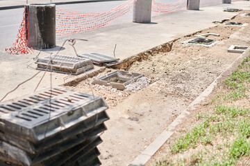 Laying concrete manholes and drain pipes for stormwater system. Connecting a trench drain to a...