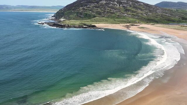 Aerial video of the Beautiful Tullagh Strands Sandy Beach on the Atlantic Ocean in County Donegal Ireland
