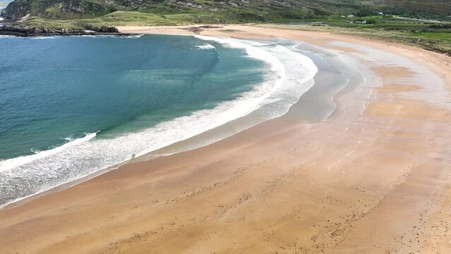 Aerial video of the Beautiful Tullagh Strands Sandy Beach on the Atlantic Ocean in County Donegal Ireland