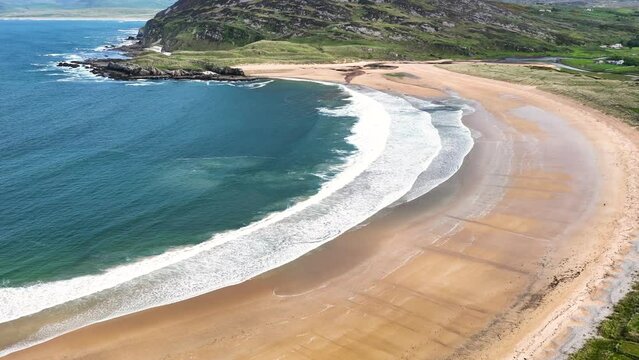 Aerial video of the Beautiful Tullagh Strands Sandy Beach on the Atlantic Ocean in County Donegal Ireland