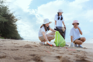 Volunteer picking up garbage activity on the beach after tourist resting in holidays weekend travel people lifestyle.