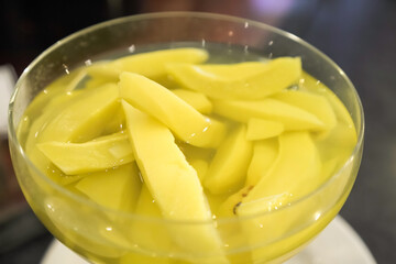 Manisan Buah Kedondong or Candied Ambarella Fruit in sweet sugar soup for dessert. Concept for Hotel Restaurant Wedding Buffet.