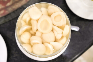Manisan Salak or Candied snakefruit - Zalacca Fruit in sweet sugar soup for dessert. Concept for Hotel Restaurant Wedding Buffet.