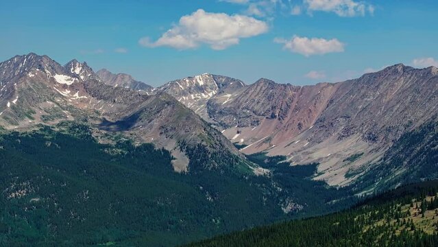 Aerial of the Rocky Mountains as seen from Cottonwood Pass near Boulder, Colorado, USA. Drone dolly back shot
