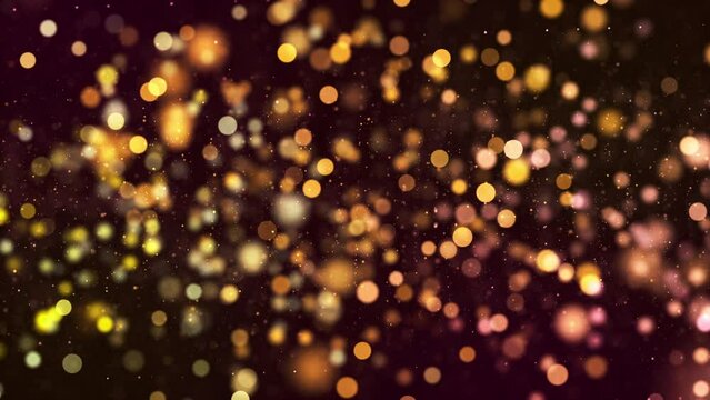 Beautiful golden bokeh particles abstract light on black background