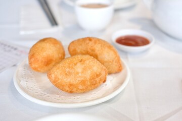 Ham sui gok: deep-fried glutinous rice dumplings filled with prawn and barbecued pork at a yum cha restaurant in Burwood Chinatown — Sydney, Australia