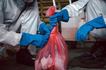 Contain Chemical Spill to Red Garbage Bags After Absorb, Part of Steps for Dealing with Chemical Spillage, Spill Cleanup Procedures, Basic Practical Training for Chemical Spill Clean-up.