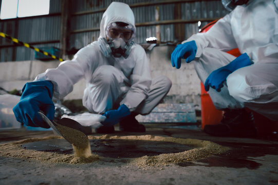 Using Sand or Sawdust to Absorbent for Oil, Acid, Chemical, Liquid Spills Cleanup. Steps for Dealing with Chemical Liquid Spillage, Part of Basic Practical Training for Chemical Spill Cleanup.