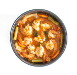 Top view of sour soup made of tamarind paste with shrimps and vegetable ,Thai food