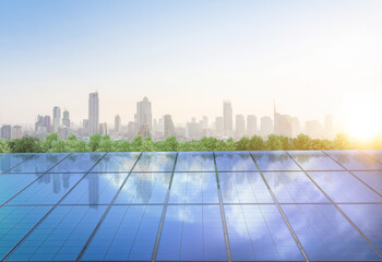 Amount of solar panels on green field or solar farm againt blue sky and cityscape background