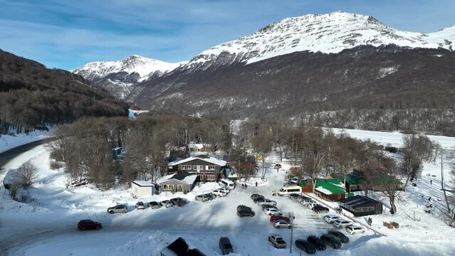 Las Cotorras Village At Ushuaia In Tierra Del Fuego Argentina. Snowy Mountains. Tierra Del Fuego Argentina. Winter Background. Las Cotorras Village At Ushuaia In Tierra Del Fuego Argentina.