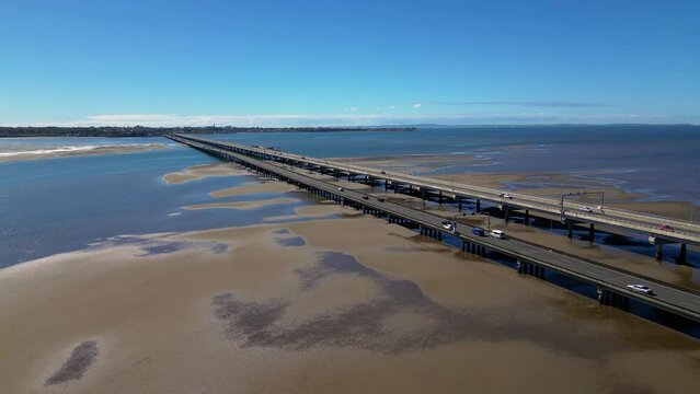 Forward moving aerial view over the Houghton Highway Bridge between Brighton and Redcliffe Peninsula, Brisbane Australia.