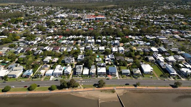Aerial view moving left to right of Sandgate and Brighton waterfront on a sunny day, Brisbane, Queensland, Australia
