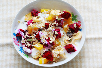 Fresh fruit with Muesli and yogurt