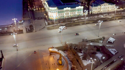 Ekaterinburg, Russia. House of Sevastyanov and Labor Square. The central street of the city is Lenin Prospect. Night city in the early spring, Aerial View
