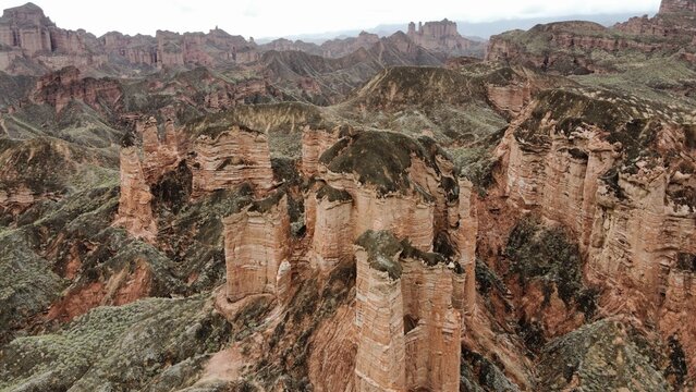 Aerial photography of the Danxia landform in Gansu, China, featuring atmospheric and wild natural scenery