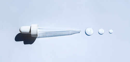 pipette drop of serum test on gray background