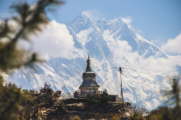 Famous Stupa in the trail to Everest Base camp with the amazing Ama Dablam Mountain in the background - Namche Bazar, Nepal