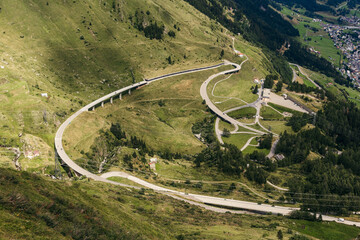 
alpine roads, serpentine, driving up the mountains, elevation difference, road surface, landscapes and roads, mountains - obrazy, fototapety, plakaty