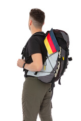 Back view portrait of trekker with a backpack and flag of Germany isolated on white background. Thirty years old man in black T-shirt posing in studio.
