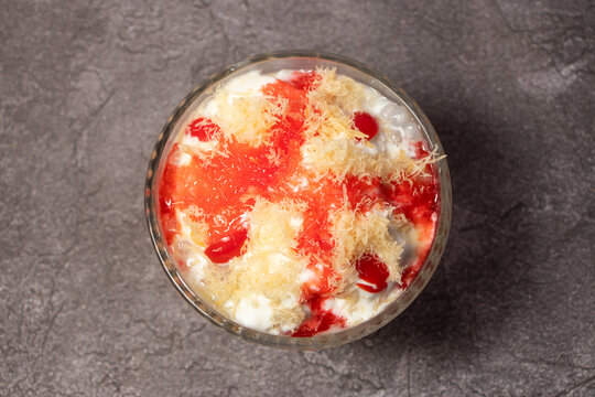 Faluda or falooda with khoya, sharbat, noodles, kulfi, mitha, rabri served in dish isolated on background top view of bangladesh food