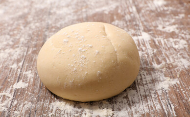 Fototapeta na wymiar fresh raw dough with flour