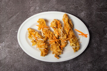 crispy fried shrimp served in dish isolated on background top view of bangladesh food