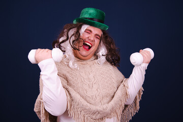 Healthy lifestyle. Funny drag queen is doing fitness and posing with different emotions on a blue...