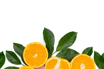 Orange fruit with green leaves on white background.