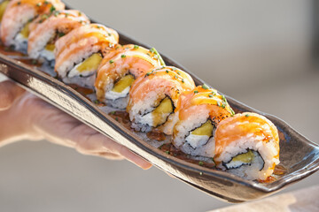 Appetizing Philadelphia maki rolls on tray