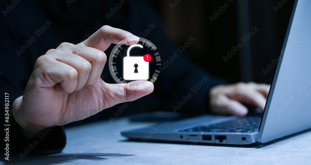 Wall mural close up hacker man hand show a unlock key after attack on privacy account system to steal data info