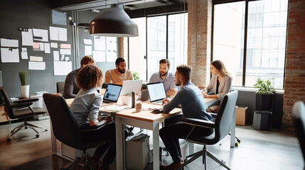 Team of start-up business people during meeting in office