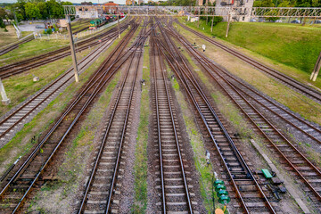 Fototapeta premium Multiple Railway Station with Wagons During Daytime From Upper Point With Railway Infrastructure.