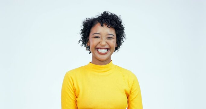 Face, happy and woman laughing in studio with confidence, joke and good mood on white background. Portrait, smile and young model with carefree personality, comedy and positive reaction to funny meme