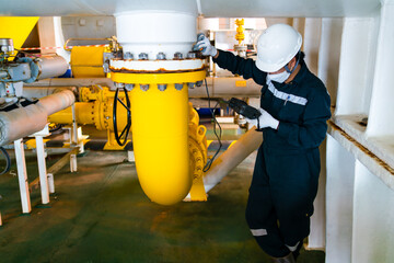 Non-destructive testing technicians are checking the thickness of elbow tubes using ultrasound (UT)...