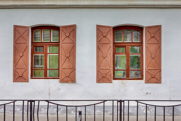 Two Symmetrical Windows and Gutter on the Wall of Building in Pinsk.