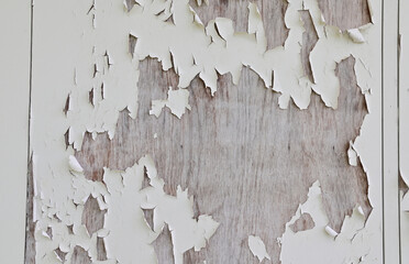 Cracked paint on the wooden floor background for design and decoration.