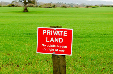 Private, No public access or right of way, sign on a wooden post