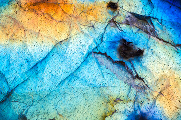 Labradorite iridescence. macro detail texture background. close-up polished semi-precious gemstone.