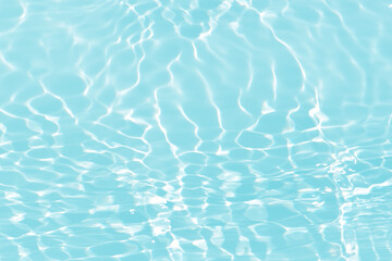 Obraz premium Blue water with ripples on the surface. Defocus blurred transparent blue colored clear calm water surface texture with splashes and bubbles. Water waves with shining pattern texture background.