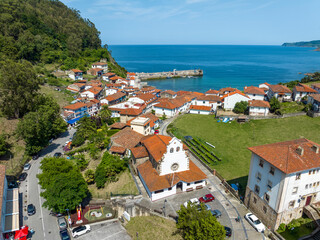 Obraz premium Aerial view Church of Iglesia San Miguel in Tazones Asturias Spain.
