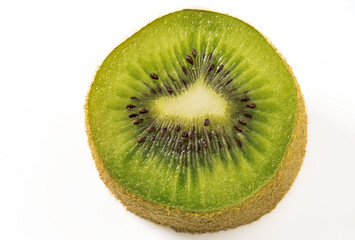 half of a ripe kiwi fruit on a white background